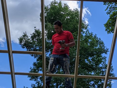 Myint Thun working on the pavilion roof.