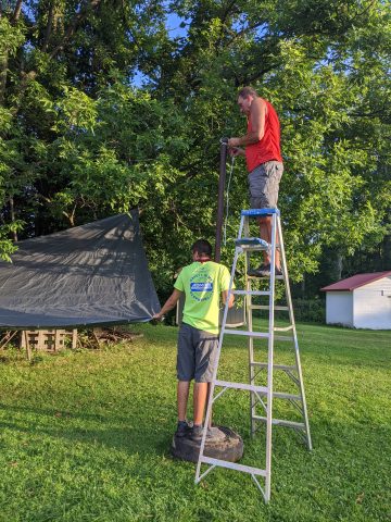 Eric Vreeland and his sons put up tarps for our outdoor learning spaces.