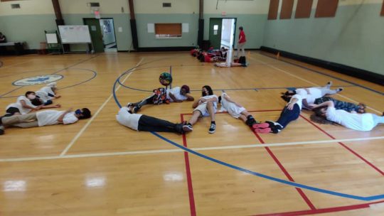 Grades 7 & 8 work together to spell the word "LOVE."