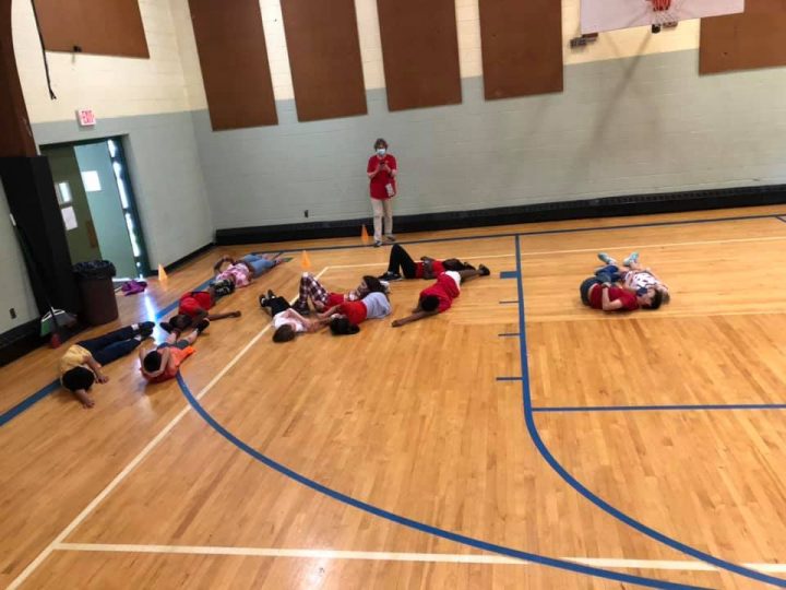Grades 5 & 6 spelling the word "PLAY."