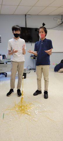 Evan and Maung with a pretty tall structure.